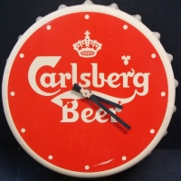 Plastic 'Carlsberg Beer' lid shaped wall clock - Sold for $49 - 2014