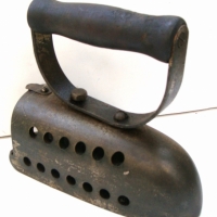1920's cast iron coal heated iron with pierced body and internal grille - Sold for $30 - 2014