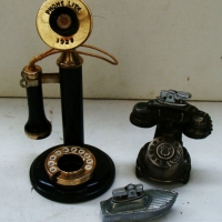 2 x novelty telephone shaped spirit cigarette lighters in the form of telephones  - candlestick phone missing lighter - Sold for $49 - 2014