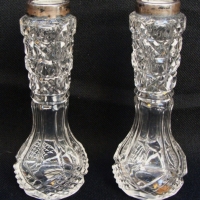 Pair of small cut glass vases with silver tops hallmarked for Birmingham 1909 - Sold for $37 - 2014