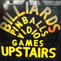 Vintage Billiards, Pinball, Vidio (sic) games upstairs  sign  - spray paint on Perspex - Sold for $37 - 2014