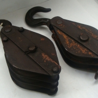 2 x Cast Iron pulleys one with 2 wheels one with 3 - Sold for $85 - 2014