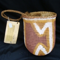 A fine open-weave woven pandanus dilly bag decorated in natural earth pigments acquired in 1982 from Katherine NT  artists name on label  - insect dam - Sold for $67 - 2014