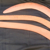 Group of three ochre boomerangs One left and one right handed fluted Western desert hunting boomerangs and a returning boomerang - Sold for $183 - 2014