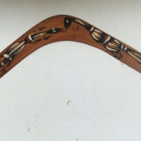 Australian Aboriginal returning boomerang with painted lizard and bird design 66cm long - Sold for $24 - 2014