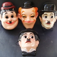 4 x vintage plastic face masks - Laurel & Hardy, Charlie Chaplin - Sold for $24 - 2014