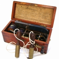 Quack medicine electric shock box  - Magneto Electric Machine  by  F McElroy Electrician Manchester circa 21880 in Mahogany box, complete with handles - Sold for $146 - 2014