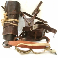 Group of WW2 and Scouting belts, gaiters, knife sheath and sword frog - Sold for $73 - 2014