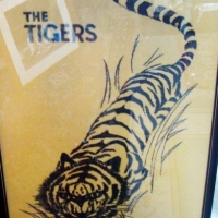 Framed large modern The Tigers  towel - image of tiger lurking through grass printed in black on yellow towel - Sold for $67 - 2014