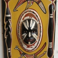 Vintage Aboriginal wall plaque with mask and applied boomerangs and spears with  x ray style painted animals - Sold for $79 - 2015