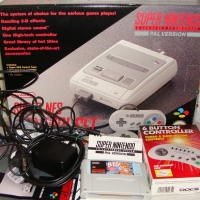 2 x Boxes inc Super Nintendo Entertainments System (SNES) - with 2 controllers + Busby game & Commodore 64 games - Sold for $256 - 2015