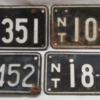 Group of NT motorcycle number plates - Black & White - Sold for $43 - 2015