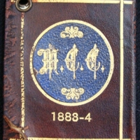 Vintage Melbourne Cricket Club (MCC) 1883-84 Membership booklet - brown and blue leather with gilded text & logo - cover gluedstuck together - Sold for $1403 - 2015
