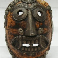 Tortoise shell mask with skull button decoration - Sold for $146 - 2015