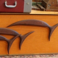 2 x 1970's framed wooden silhouettes  on orange background incl Cat and leaping dolphins - Sold for $85 - 2015