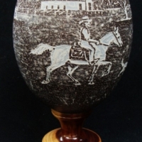 Circa 1933 hand carved EMU EGG with an image of Sheep Station with stockman, dog & sheep - mounted on a Mulga stand - carved by KWard Bourke Approx 22 - Sold for $49 - 2015