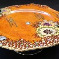 1930s Royal Winton orange lusterware cake stand with chrome musical stand - Sold for $30 - 2015