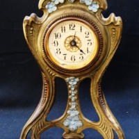 American Western Clock Company Cast iron metal cased Art Nouveau clock with floral adornment - Sold for $146 - 2015