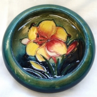 William Moorcroft bowl Fresia  on green ground - impressed mark potter to HM the Queen & painted signature - 1928-53 - 10 cmD - Sold for $110 - 2015
