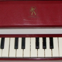 Vintage Hohner Melodica Piano 27 in maroon & cream colours with original carry case - Sold for $33 - 2015