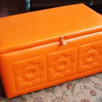 Lot 128 - Retro orange vinyl padded seat trunk - Sold for $79