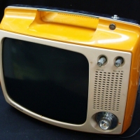 Lot 129 - Portable AWA deep image Television - mustard colour - Sold for $61