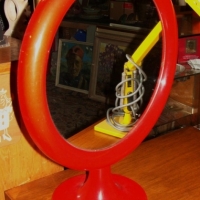 Red retro plastic mirror on pedestal base - Sold for $43