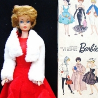 2 x Barbie items incl original 1960's Mattel Barbie box & 1962 blond bubble cut Barbie in a red dress & original faux fur jacket - Sold for $128 - 2015