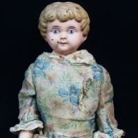 c1915 German Minerva Doll with metal head, painted features, moulded hair, cloth body , bisque hands & forearms, wearing original clothing, marked to  - Sold for $67 - 2015