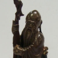 Japanese lacquered wood figure of a wise man holding fruit & a staff - Sold for $30 - 2015