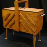 1950's wooden Cantilevered Sewing Box with splayed legs,  handles & contents inc, zips, cotton reels, fasteners, etc - Sold for $43 - 2015