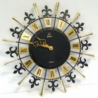 Unusual 1960's black & gilded metal Kaus quartz wall clock - Sold for $24 - 2015