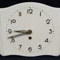 Vintage cream coloured ceramic wall hanging clock - Sold for $55 - 2015