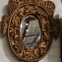 Vintage oval shaped gilt framed beveled mirror - ornately carved - Sold for $49 - 2015