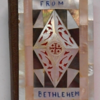 Vintage Souvenir from Bethlehem - prayer and hymn book with mother of pearl inlaid covers, inscribed inside cover 1942 - Sold for $43 - 2015