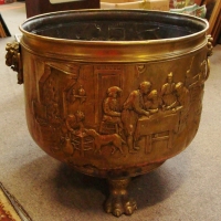 Large brass planter - raised tavern scene decoration and claw feet - Sold for $171 - 2015
