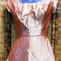 1940's knee length apricot satin dress with scooped neckline, fitted waist, zip to back and detail of ruched satin flowers to front skirt - Sold for $49 - 2015