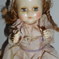 c 1950s Pedigree doll with sleep eyes and original clothes - approx l 20cm - Sold for $24 - 2015