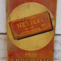 Vintage NESTLE Milk Chocolate tin advertising sign with raised text & chocolate bar - Sold for $537 - 2015