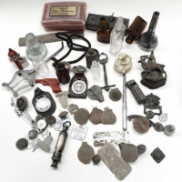 Small box mixed items incl instrument mouth piece, miniature weights, Acme whistle, dog tags army badges etc - Sold for $55 - 2015