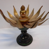 Heavy eastern brass temple ornament with Buddha sitting in opening lotus flower - Sold for $55 - 2015