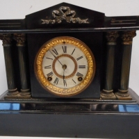 c 1910 Ansonia heavy metal mantle clock with columns and gilt embellishment to front - Sold for $122 - 2015