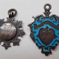 2 x vintage Dux badges inc - one dated 1910 - both with hallmarks - Sold for $43 - 2015