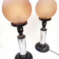 Art deco pair of tablebedside lamps - Chrome stand with round bakelite base, fixtures & textured peach coloured round shades - Sold for $195 - 2015