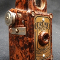 1930's Brownblack mottled Coronet Midget spy camera - 16mm - gc - Sold for $128 - 2015