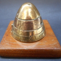 1916 brass bomb timer nose fuse Trench art on wooden base - Sold for $116 - 2015