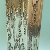 1978 DON SHEIL metal vase with abstract raised decoration & signature - approx 20cm H - Sold for $24 - 2015