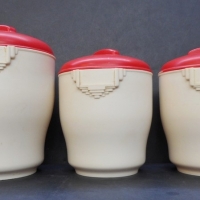 3 vintage Bakelite kitchen canisters by Bristolite cream body with red lids - Sold for $43 - 2015