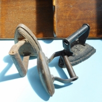 Group lot -  3 x cast sad irons and a wooden paper tray - Sold for $43 - 2015