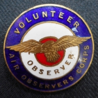 Vintage enameled badge Volunteer Air Observers Corps - blue, white & red with eagle to centre - marked Property of Dept of Air verso - Sold for $37 - 2015